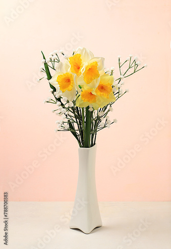 Beautiful spring floral arrangement.Empty podium for product with fresh daffodil flowers,elegant beauty concept.Minimal modern aesthetic