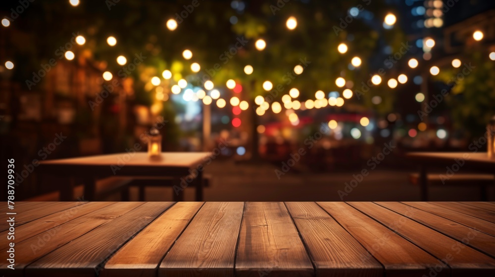 Empty wood table for product display in blur background of admirable restaurant at night