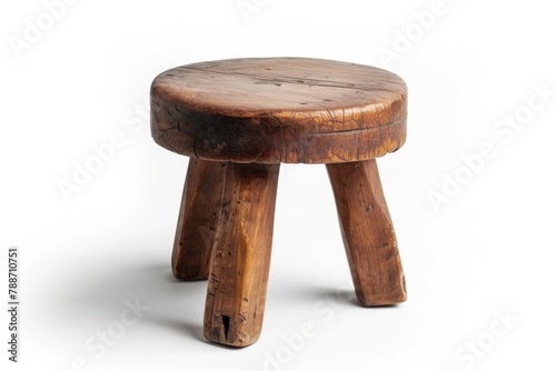 Vintage antique three legged stool isolated on white background. © darshika