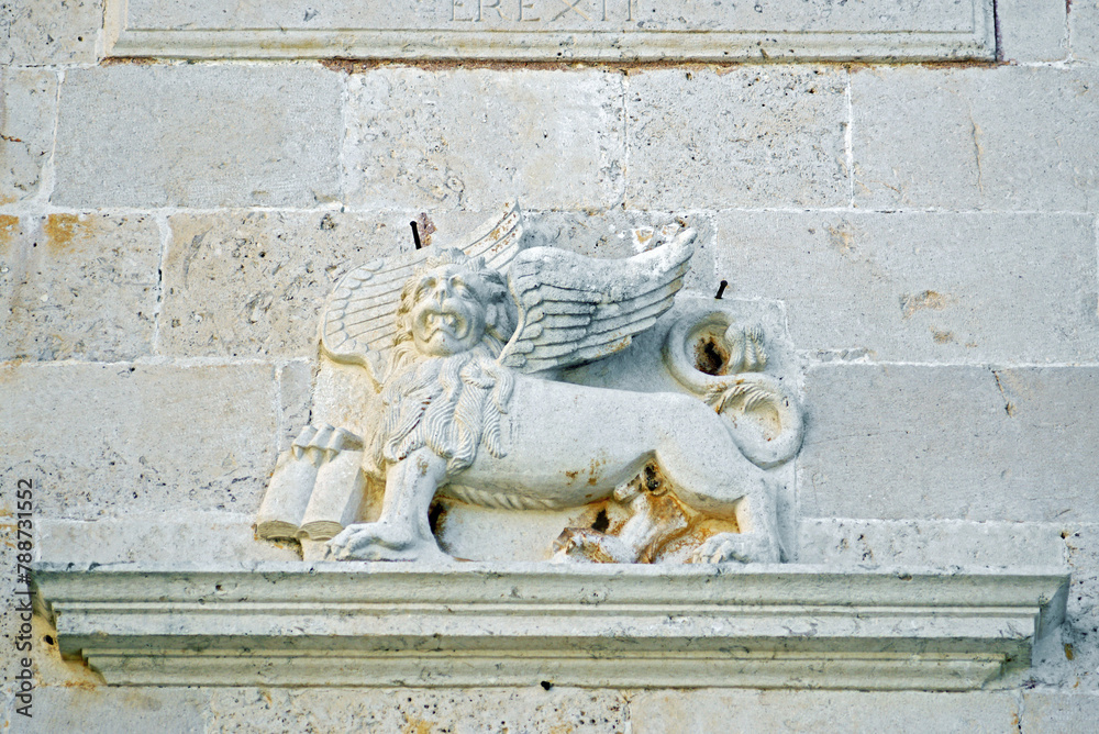 A relief image of a lion above the entrance to the old Venetian Church of St. Mark in the city of Perast, Montenegro