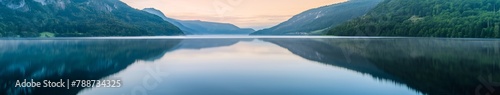 Calm Lake Reflecting Mountains at Sunset © Saltanat
