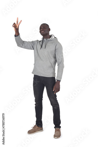  man showing victory sign with fingers, look up on white background