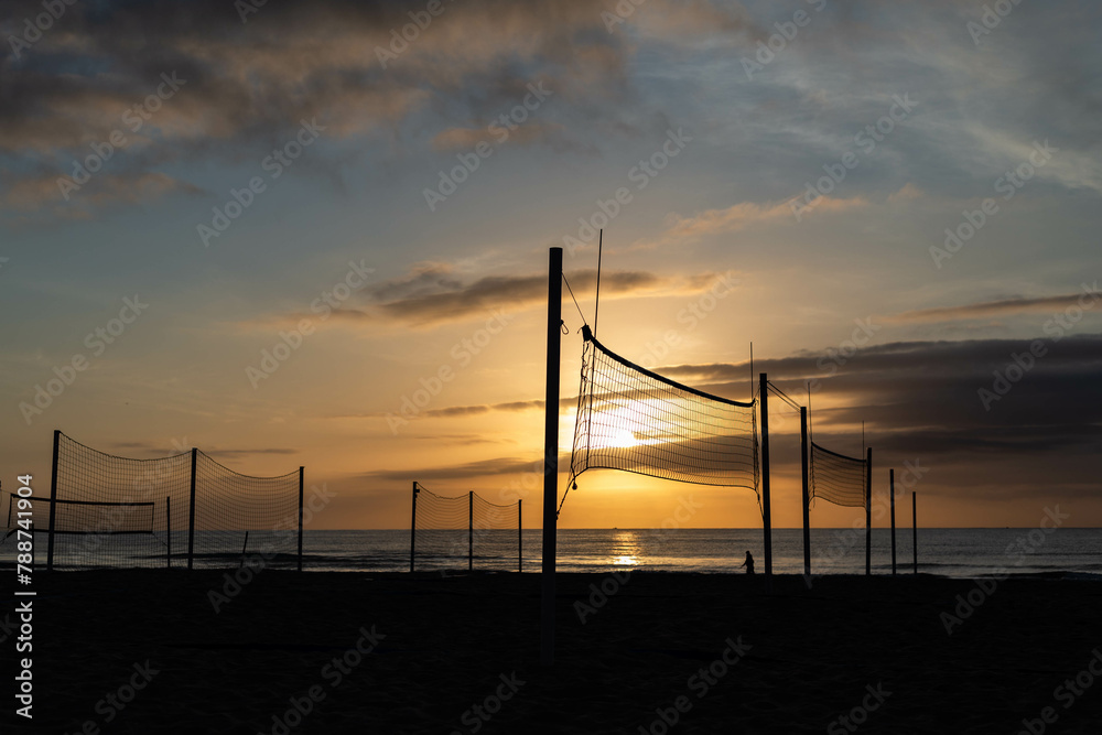 Obraz premium volleyball nets on Alicante beach at sunrise