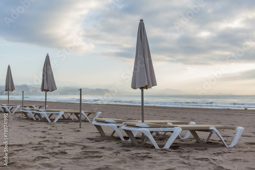 beach chairs and umbrellas on the beach © elias