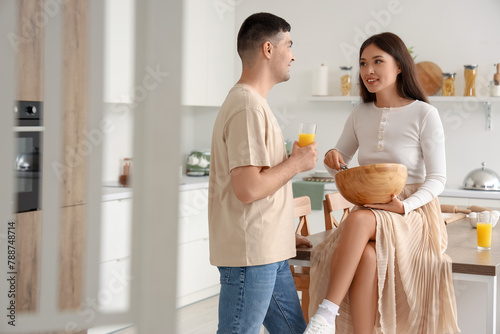 Happy young couple cooking ...