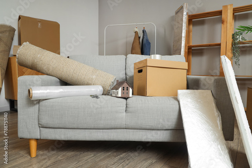 Sofa with house model, keys...