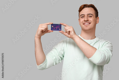 Young man with credit card ...