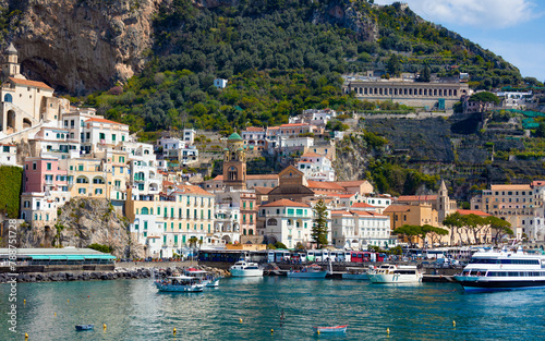 Beautiful Amalfi on hills leading down to coast, azure sea in Campania, Italy