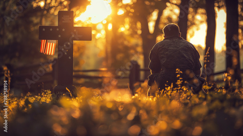 A solitary figure kneeling in front of a cross adorned with an American flag, paying silent tribute to fallen heroes under the warm glow of sunlight.