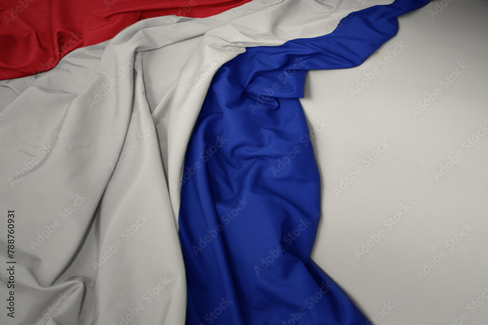 waving national flag of netherlands on a gray background. waving national flag of netherlands on a gray background.