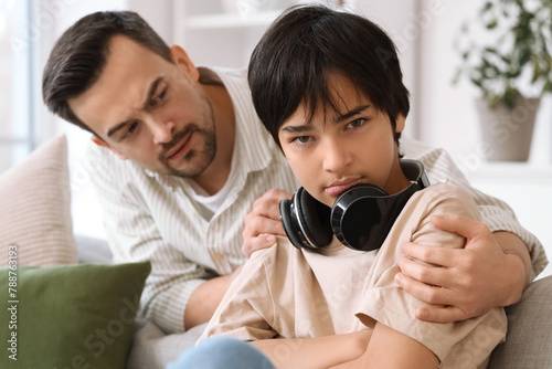 Upset teenage boy with his ...