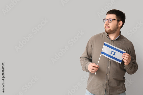 Young Jewish man with flag ...