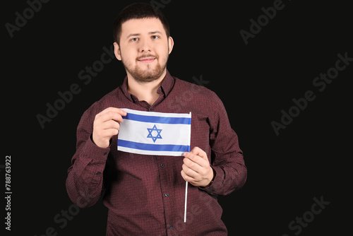 Young Jewish man with flag ...