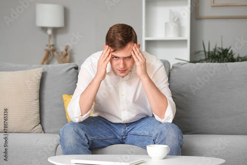 Young man suffering from he...