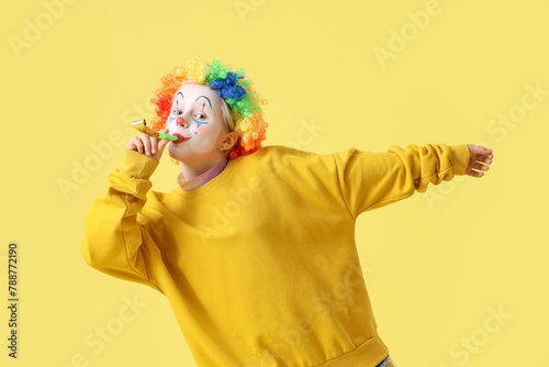 Funny little girl in clown ...
