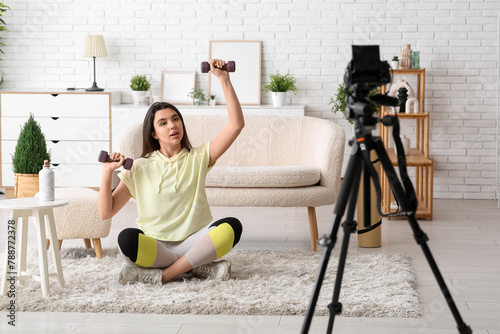 Female sports blogger with ...