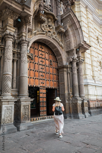 Tourist entering a church in Lima Peru. Copy space.