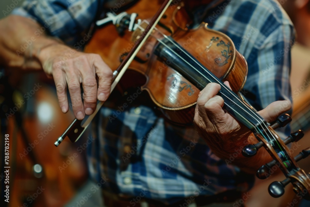 A man passionately plays the violin in a warmly lit room, his fingers dancing across the strings as music fills the space. A man passionately plays the violin in a warmly lit room, his fingers dancing across the strings as music fills the space.