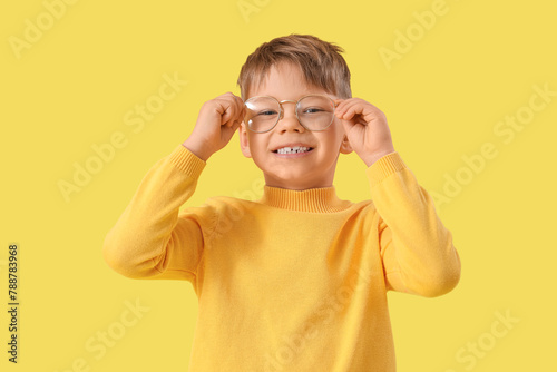 Cute little boy in eyeglass...