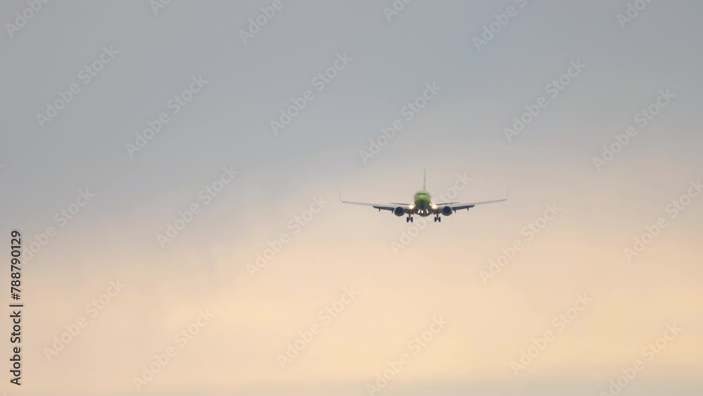 Jet passenger plane approaching landing. Airliner descending. Airplane in the sky Jet passenger plane approaching landing. Airliner descending. Airplane in the sky