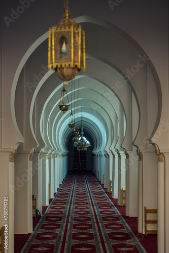 Tranquil archway corridor in a Moroccan mosque photo