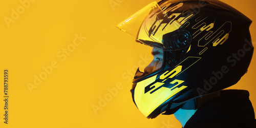 man in a helmet on a yellow background , copy space