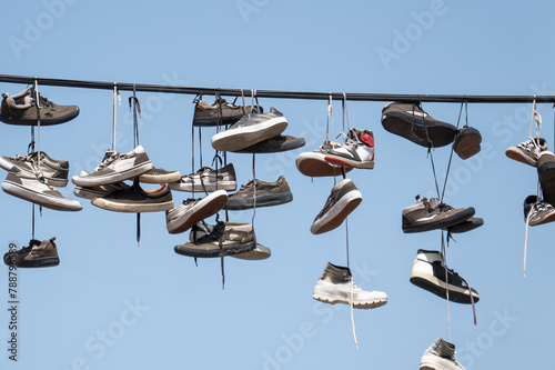 Shoes hanging on electric wires on the street