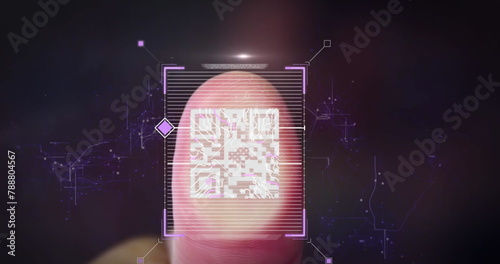 A fingerprint is undergoing scanning, surrounded by digital graphics