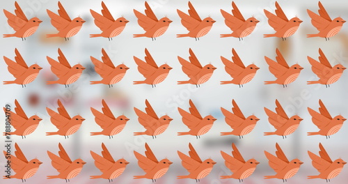 Multiple orange birds with wings spread are repeating across background