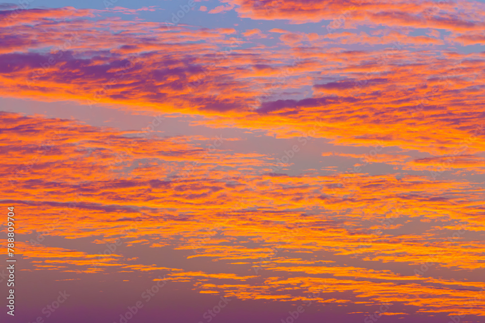 Fototapeta premium A panoramic view of colourful beatiful evening sky with pink, purple, peach and orange clouds, Doha, Qatar