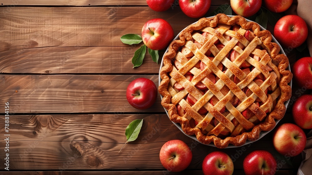 Freshly baked apple pie with lattice crust surrounded by whole apples on wooden table Freshly baked apple pie with lattice crust surrounded by whole apples on wooden table