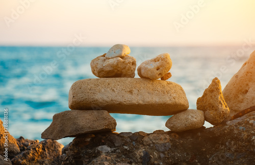Many ZEN stones on the sunset beach.