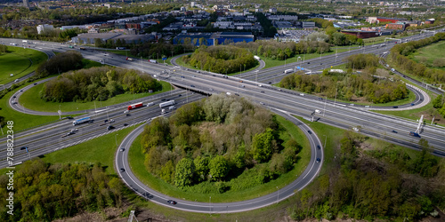 Wide angle view of roundabout Hoevelaken intersection transit aerial near Amersfoort in Dutch landscape. Infrastructure and urban transportation in The Netherlands seen from above