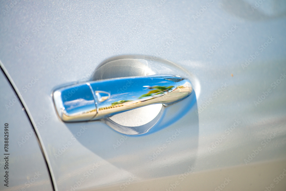 A car door handle, reflections A car door handle, reflections