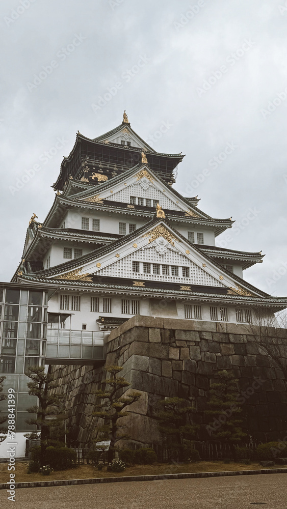 Osaka, Japon. March 28, 2024: Osaka castle tower on a gray day. Osaka, Japon. March 28, 2024: Osaka castle tower on a gray day.