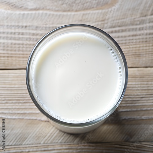 Cup with milk on white background. Top view 
