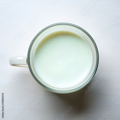 Cup with milk on white background. Top view 
