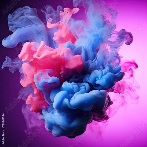 Abstract pink and blue cloud of ink in water on a black background.