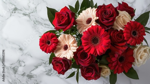 A beautiful and creative bouquet featuring roses and gerbera daisies sits elegantly against a marble backdrop exuding charm and warmth Perfect for occasions like Valentine s Day or Mother s