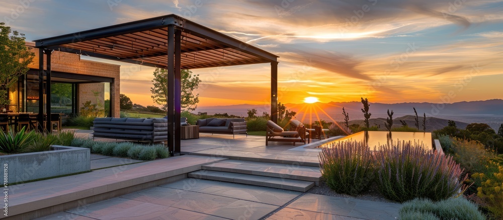 Fototapeta premium Interior design: Attractive contemporary outdoor seating area with a pergola during sunset.