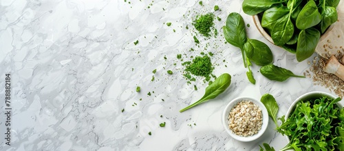Raw fresh green vegetables, unprocessed grains set on a light grey marble kitchen counter, seen from above with space for text. Healthy eating concept emphasizing clean, vegan, vegetarian, detox,