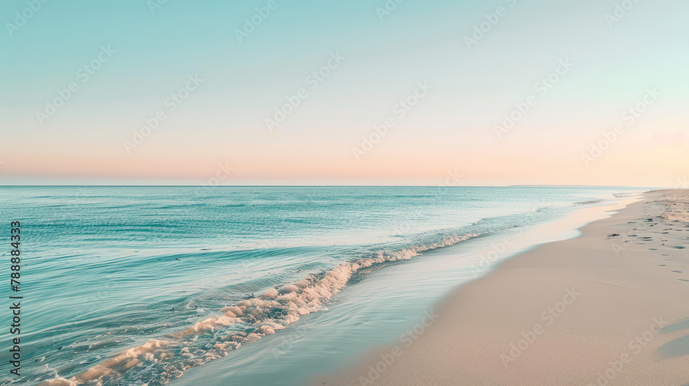 Beautiful sunrise over tranquil beach with gentle waves and clear skies
