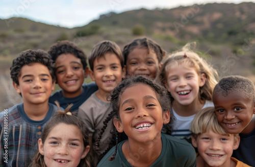 A group of multiethnic children smile and play together outdoors on a sunny day