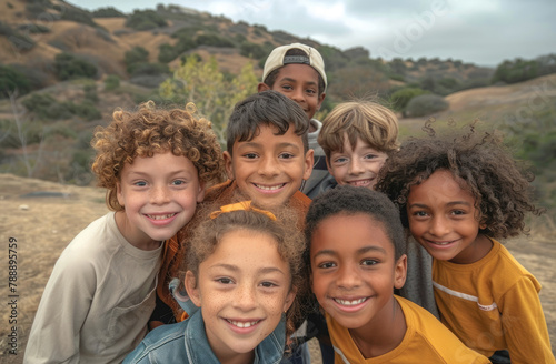 A group of multiethnic children smile and play together outdoors on a sunny day