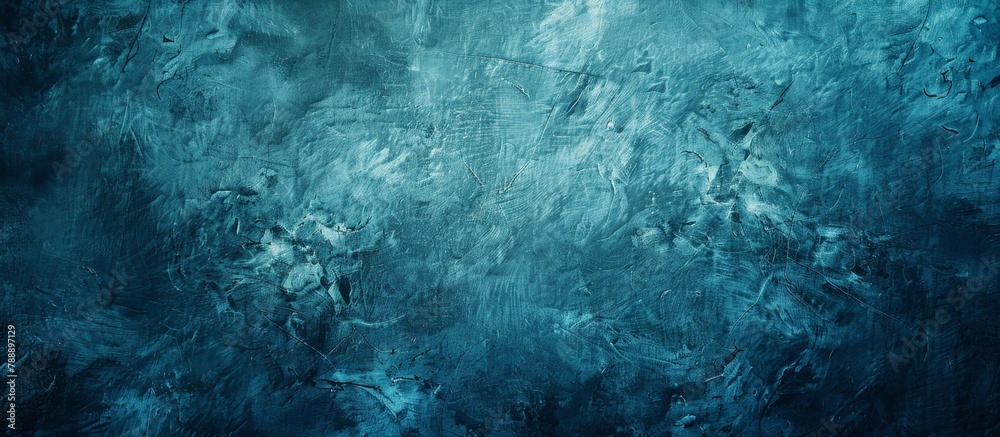 Blue abstract artwork with intricate brush strokes displayed against a dark black backdrop in a close-up shot
