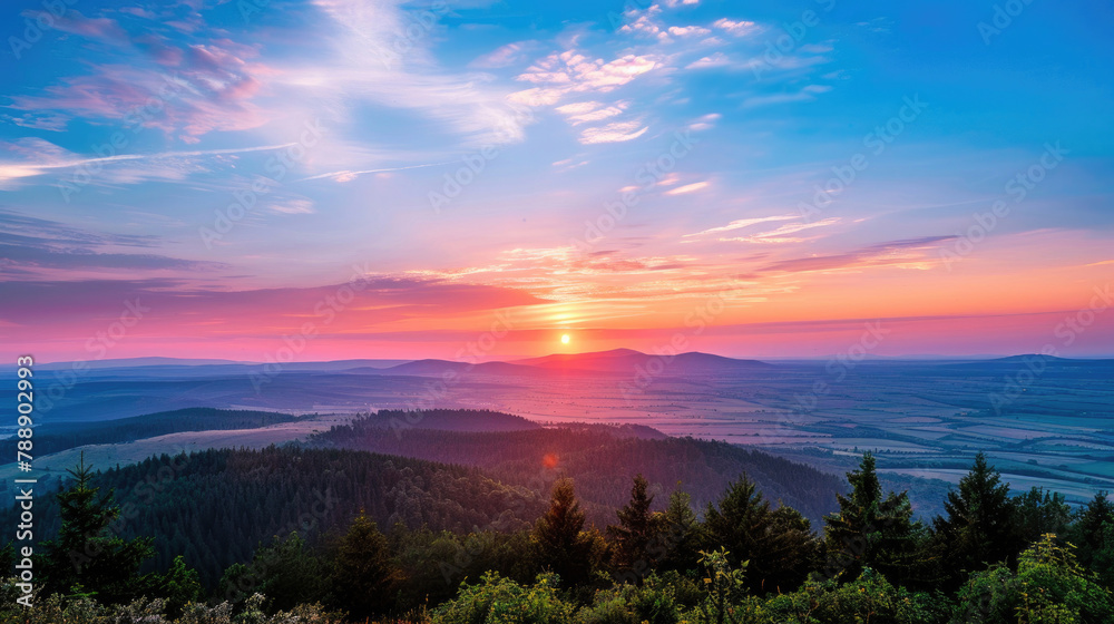 A breathtaking view of the sun setting on the horizon during the summer solstice