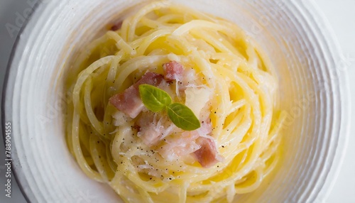 Spaghetti cabonara on a white plate. Top view.
 photo