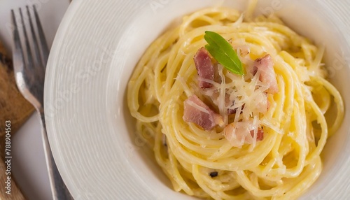 Spaghetti cabonara on a white plate. Top view.
 photo