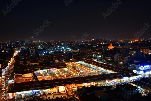 A panoramic view of the bustling night market  with rows of twinkling lights stretching into the distance  creating a dazzling spectacle against the darkened sky  Generative AI