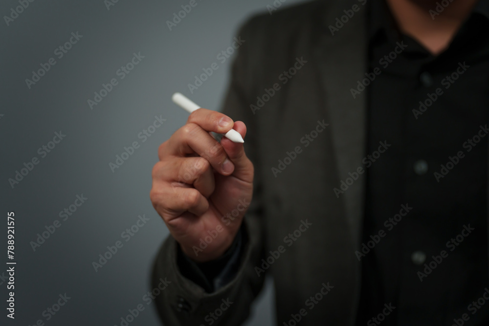 businessman hand using digital pen writing on empty virtual screen businessman hand using digital pen writing on empty virtual screen